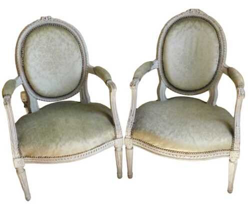 A pair of 19thC Louis XVI style grey painted fauteuil, each with a heavily carved ribbon and...
