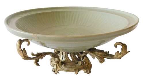 A Chinese porcelain celadon dish, of circular form, with floral centre and textured border, on...