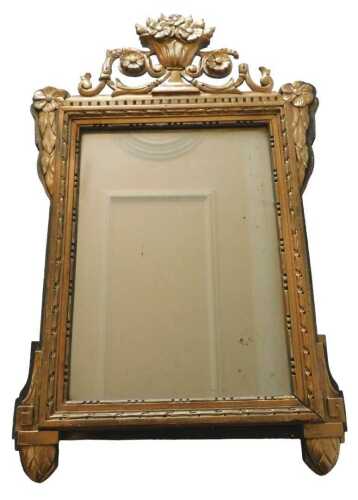A 19thC Italian Neoclassical giltwood wall mirror, the plain rectangular glass in a heavily...