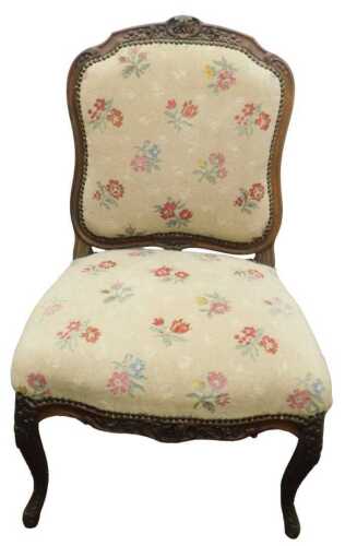A 19thC French oak side chair, with heavily carved flower head and scroll frame, with...