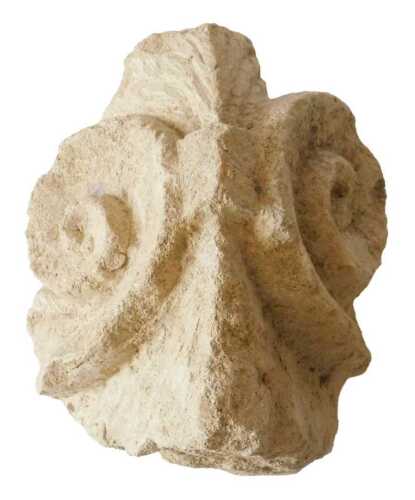 An antique carved stone capital fragment, possibly medieval, 14thC or other, with part scroll...