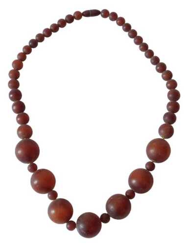 A cherry amber bead necklace, each bead ranging from 2cm to around 0.3cm. (AF) Offsite Sale -...
