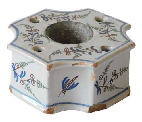 A 19thC French faience inkwell, of inverted square form, with central recess, the main body with...
