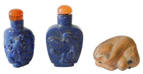 A Chinese carved lapis snuff bottle, with compressed orange stopper, raised with figures, 6cm...