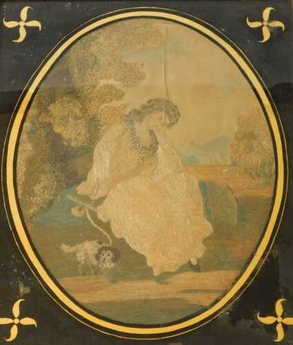 An early 19thC oval silk embroidery, of a young woman seated in a landscape with a dog at her...