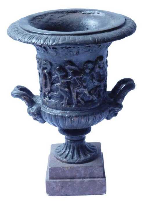 A campana shaped composition urn, decorated with a band of putti, on a square plinth, 30cm high....