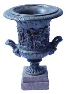 A campana shaped composition urn, decorated with a band of putti, on a square plinth, 30cm high....