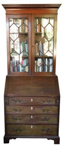A late 19th/early 20thC mahogany bureau bookcase, the top with a dentil cornice above two...