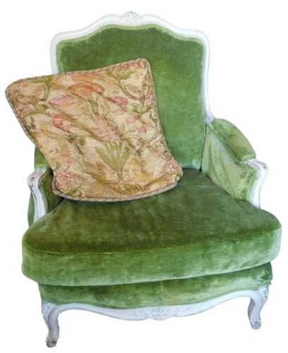 An early 20thC French cream painted armchair, the moulded showframe decorated with scrolls and...