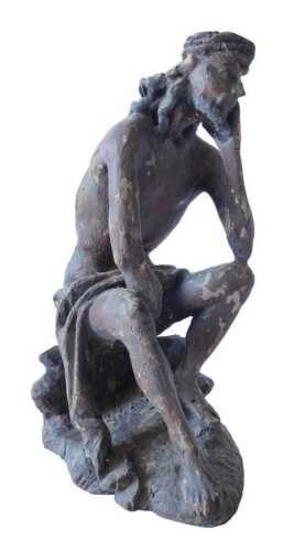 A late 18th/early 19thC Continental polychrome decorated figure of seated Christ, on a shaped...