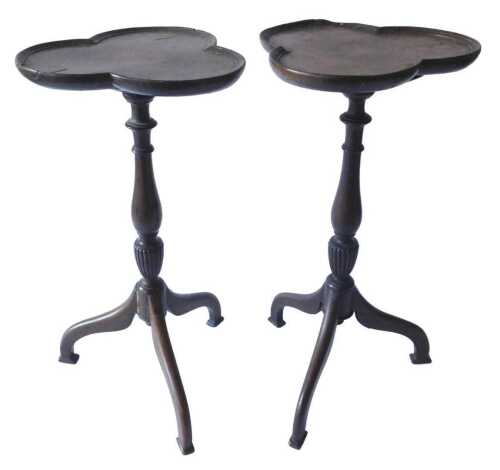 A pair of Edwardian mahogany wine tables, each with a trefoil top, with central inlaid paterae...