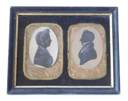 A pair of 19thC portrait silhouettes, depicting a lady and gentleman facing each other, 8cm x...