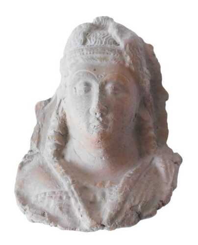 A terracotta bust of a female, possibly Cypriot or Greek late Hellenistic, 10cm x 8cm. Offsite...