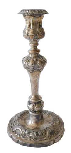 A Victorian silver plated candlestick, cast with leaves, on a tapering foot, 25cm high. (AF)...