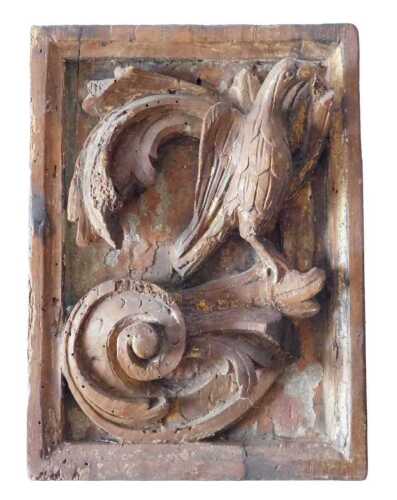 A late 17th/early 18thC carved panel, of a hoho bird seated on a scroll, 24cm x 18cm. Offsite...
