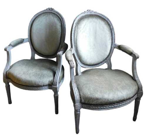 A pair of 19thC French fauteuil, the moulded back carved with ribbons and flowers, with a padded...