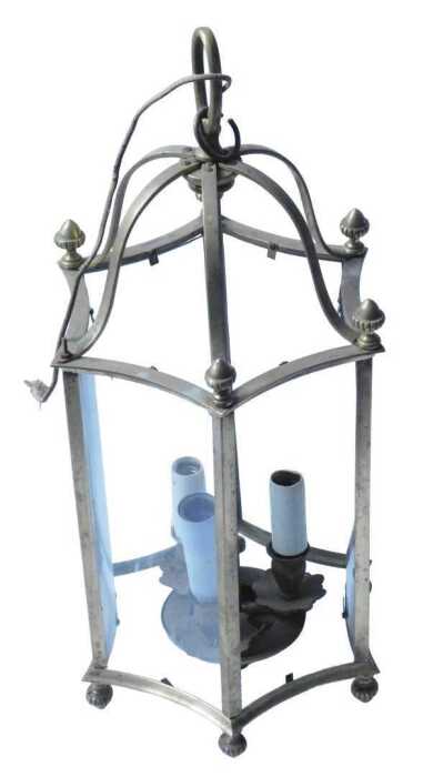 A brass hanging lantern, with turned finials, concave glass, and fitting for three bulbs, 94cm...