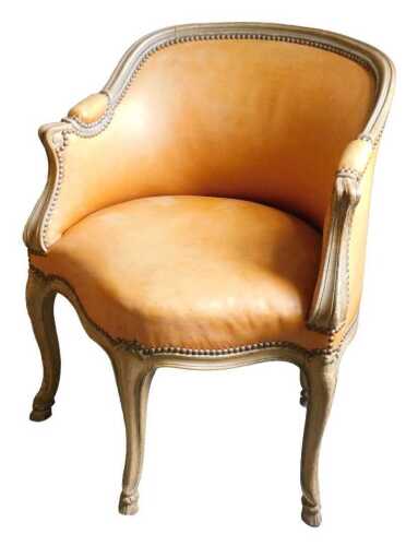 A 19thC French beech transitional desk chair, with a moulded frame, upholstered in tan coloured...