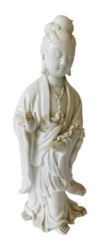 A Chinese blanc de chine figure of Guanyin, 27cm high. Offsite Sale - Buying & Collecting Notes:...