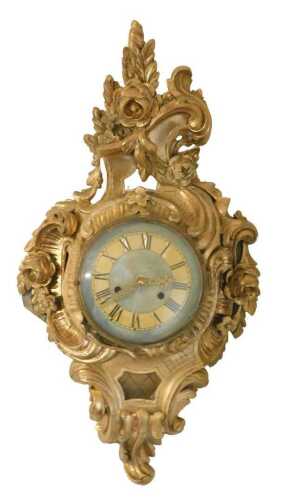 A 19thC French giltwood and gesso comptoise clock, the Roman numeric dial later painted in cream...
