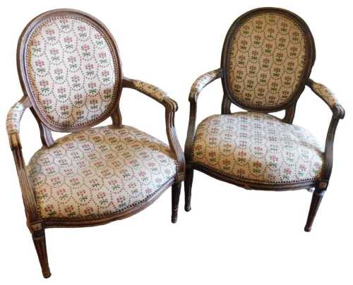 A late 19thC French beech fauteuil, with a moulded frame, padded back, arm rest and seat...