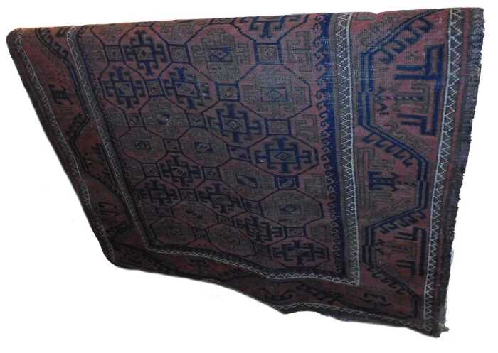 A Tekke Turkoman rug, with a design of medallions, on a red ground, one wide and two narrow...