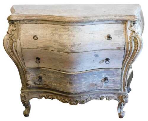 A 19thC Italian painted bombe commode, the top with a moulded edge, above three drawers, each...