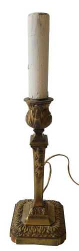 A 19thC French brass candlestick, the sconce cast with leaves on a square tapering reeded column...