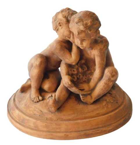 A Continental terracotta figure group of two putti with flowers, on oval base, 29cm wide....