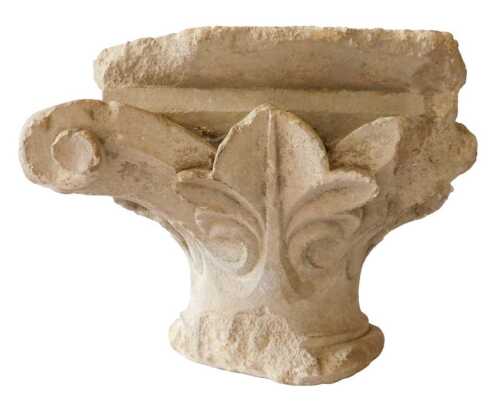 An architectural column capital, probably 18thC limestone, decorated with leaves, 21cm high....