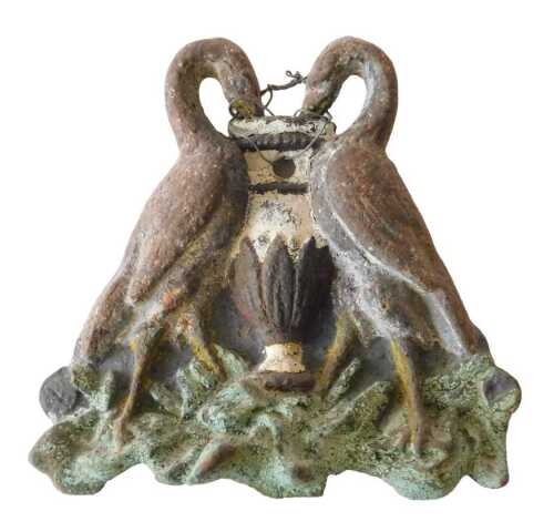 A 19thC polychrome cast iron architectural plaque motif, formed by two symmetrical swans around...
