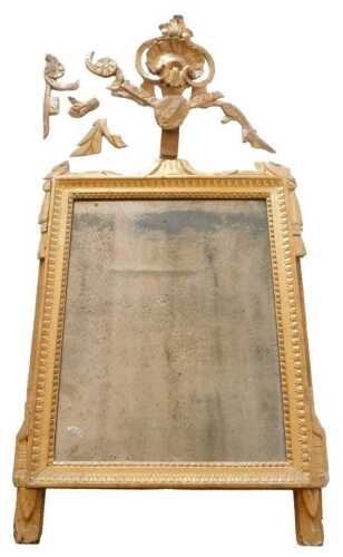 An 18thC giltwood wall mirror, surrounding the plate, surmounted by a part rococo style shell...