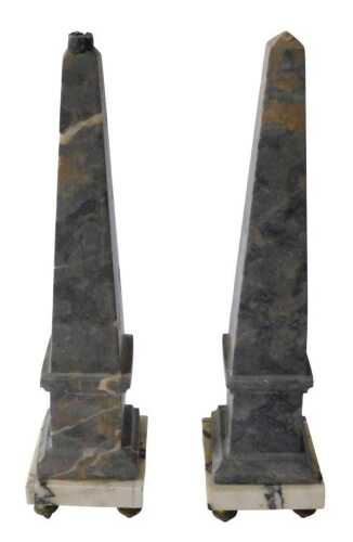 A pair of Grand Tour style marble table obelisks, each of tapering form, on square stepped bases,...