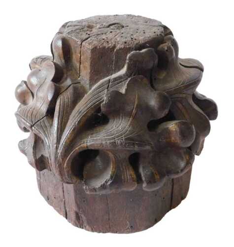 A 19thC heavily carved oak capital, profusely decorated with scrolls and flowers, probably 17thC,...