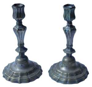 A pair of 18thC French silvered brass candlesticks, each with a knot column and shaped stepped...