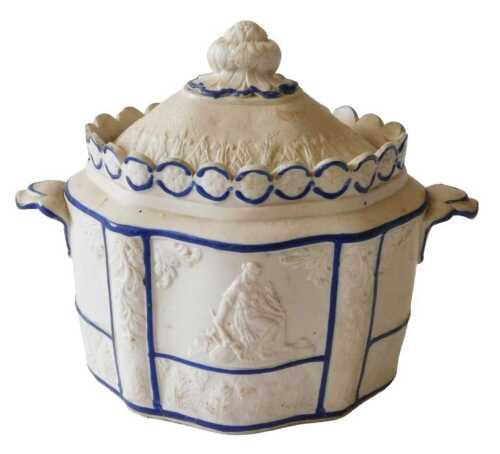 A 19thC Castleford pottery sucrier, of oval form, the removable lid with an acanthus leaf border...