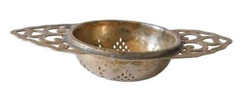 A George V silver tea strainer, the circular pierced section flanked by pierced scroll handles,...