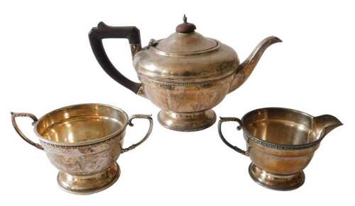 A George V silver three part tea service, comprising teapot with compressed circular knop,...