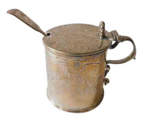 A Victorian silver mustard pot, of cylindrical form, the hinged lid with shell capped and plain...