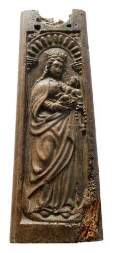 A heavily carved oak panel, decorated with virgin and child, with plain surround, possibly 17thC,...