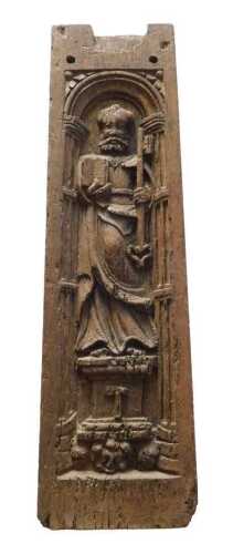 A heavily carved retablo type oak panel, decorated with Saint Paul, with plain surround,...
