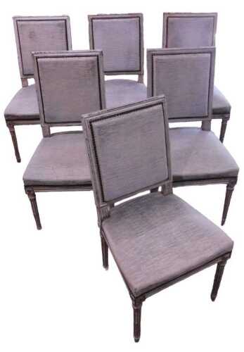 A set of six Louis XVI style painted white dining chairs, each with padded and studded backs and...