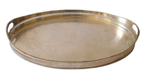 An early 20thC silver-plated galleried tray, of oval form, with pierced gallery compressed feet,...