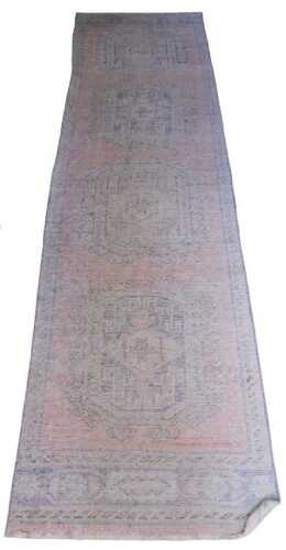 A modern Eastern style runner, with a geometric pattern predominantly in blue and red, 340cm x...