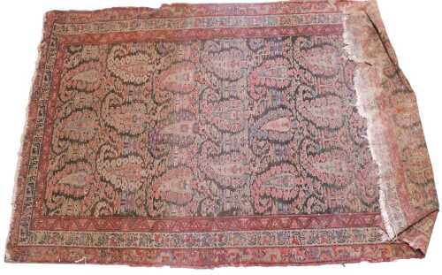 A Persian Kerman style rug, the outer field with a repeat geometric border, the inner section...