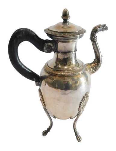 An early 20thC electroplated coffee pot, neoclassical design with three feet, 26cm high. Offsite...