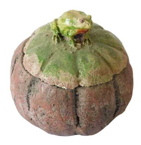 A raku glazed studio pottery box and cover, the lid mounted with a frog finial, 10cm diameter....