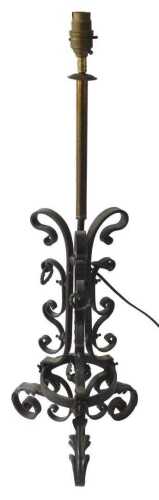 An Arts & Crafts style wrought iron table lamp base, with brass mounts, 71cm high. Offsite Sale...