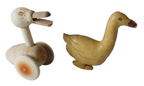 A small wooden pull along duck toy, and a yellow painted canvas duck. (2) Offsite Sale - Buying...