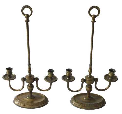 A pair of French brass two branch candelabra, each with carrying handle, on an oval base, 28.5cm...